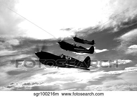 A group of P-40 Warhawks fly in formation near Nampa, Idaho. View Large Photo Image Picture - A group of P-40 Warhawks fly in formation near Nampa, Idaho.. Fotosearch