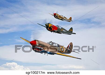 A group of P-40 Warhawks fly in formation near Nampa, Idaho. View Large Photo Image Picture - A group of P-40 Warhawks fly in formation near Nampa, Idaho.. Fotosearch