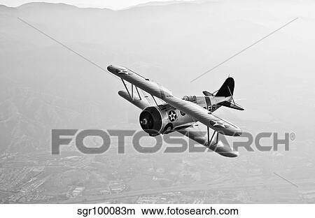A Grumman F3F biplane in flight. View Large Photo Image Picture - A Grumman F3F biplane in flight.. Fotosearch