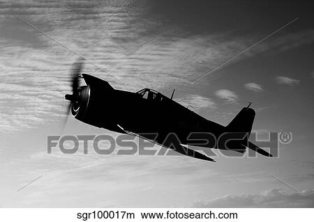 A Grumman F6F Hellcat fighter plane in flight. View Large Photo Image Picture - A Grumman F6F Hellcat fighter plane in flight.. Fotosearch