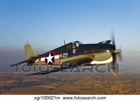 A Grumman F6F Hellcat fighter plane in flight. View Large Photo Image Picture - A Grumman F6F Hellcat fighter plane in flight.. Fotosearch