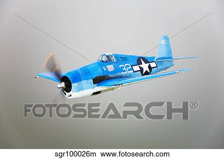 A Grumman F6F Hellcat fighter plane in flight. View Large Photo Image Picture - A Grumman F6F Hellcat fighter plane in flight.. Fotosearch
