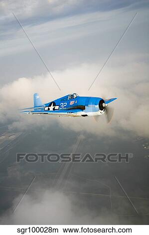 A Grumman F6F Hellcat fighter plane in flight. View Large Photo Image Picture - A Grumman F6F Hellcat fighter plane in flight.. Fotosearch