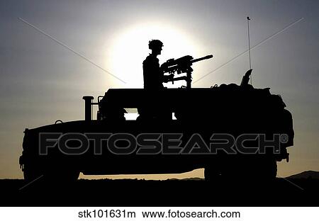 A gunner mans an MK-19 40mm Machine Gun mounted on a humvee. View Large Photo Image Picture - A gunner mans an MK-19 40mm Machine Gun mounted on a humvee.. Fotosearch