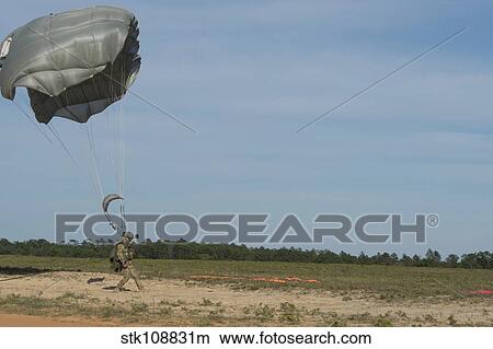 Picture - A HALO jumper lands on the landing zone in Florida.. Fotosearch