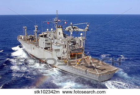 A helicopter clears the flight deck of the Military Sealift Command ammunition ship USNS Flint. View Large Photo Image Picture - A helicopter clears the flight deck of the Military Sealift Command ammunition ship USNS Flint.. Fotosearch