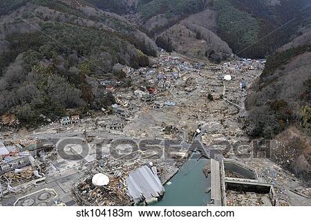 A helicopter team surveys the tsunami and earthquake damage over Japan. View Large Photo Image Picture - A helicopter team surveys the tsunami and earthquake damage over Japan.. Fotosearch
