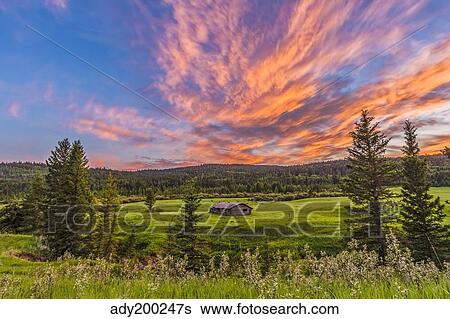 A high dynamic range photo of a sunset over a log cabin. View Large Photo Image Stock Photograph - A high dynamic range photo of a sunset over a log cabin.. Fotosearch