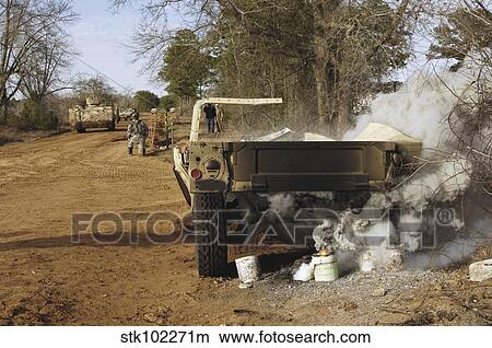 A humvee burns after a simulated roadside bomb explosion. View Large Photo Image Picture - A humvee burns after a simulated roadside bomb explosion.. Fotosearch