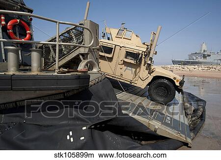 A Humvee debarks a landing craft air cushion. View Large Photo Image Picture - A Humvee debarks a landing craft air cushion.. Fotosearch