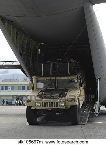 A Humvee is deployed from a C-130J Super Hercules. View Large Photo Image Picture - A Humvee is deployed from a C-130J Super Hercules.. Fotosearch