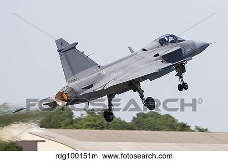 A JAS-39 Gripen of the Swedish Air Force taking off. View Large Photo Image Picture - A JAS-39 Gripen of the Swedish Air Force taking off.. Fotosearch