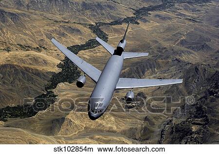 A KC-10 Extender aircraft moves out of position after receiving fuel. View Large Photo Image Picture - A KC-10 Extender aircraft moves out of position after receiving fuel.. Fotosearch