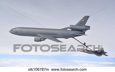 Picture - A KC-10 Extender refuels an F-22 Raptor.. Fotosearch