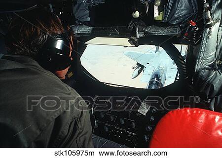 A KC-135 boom operator watches an F-15 Eagle line up for refueling. View Large Photo Image Picture - A KC-135 boom operator watches an F-15 Eagle line up for refueling.. Fotosearch