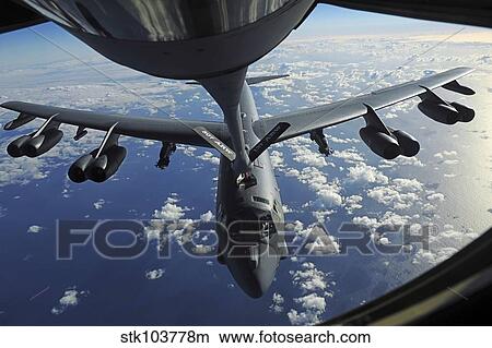 A KC-135 Stratotanker aircraft refuels a B-52 Stratofortress aircraft over the Pacific Ocean. View Large Photo Image Picture - A KC-135 Stratotanker aircraft refuels a B-52 Stratofortress aircraft over the Pacific Ocean.. Fotosearch