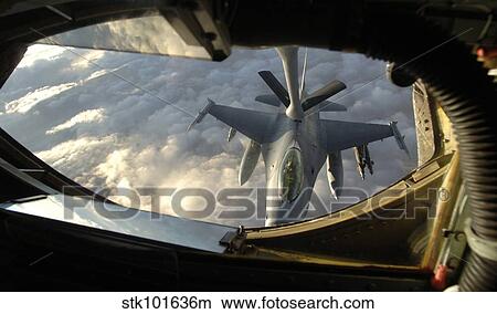 A KC-135 Stratotanker connects with an F-16 Fighting Falcon. View Large Photo Image Picture - A KC-135 Stratotanker connects with an F-16 Fighting Falcon.. Fotosearch