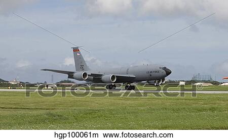 A KC-135 Stratotanker lands on the runway at Kadena Air Base, Japan. View Large Photo Image Picture - A KC-135 Stratotanker lands on the runway at Kadena Air Base, Japan.. Fotosearch
