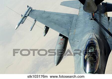 A KC-135 Stratotanker refueling an F-16CJ Fighting Falcon over Iraq. View Large Photo Image Picture - A KC-135 Stratotanker refueling an F-16CJ Fighting Falcon over Iraq.. Fotosearch