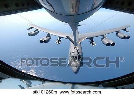 A KC-135 Stratotanker refuels a B-52 Stratofortress over the Indian Ocean. View Large Photo Image Picture - A KC-135 Stratotanker refuels a B-52 Stratofortress over the Indian Ocean.. Fotosearch