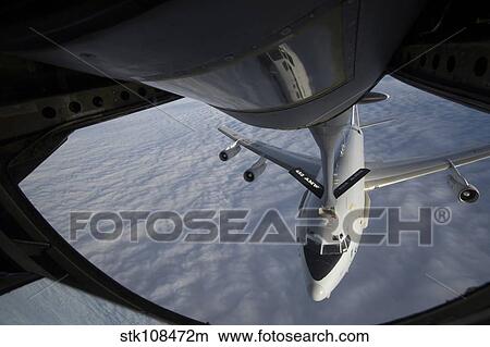 A KC-135 Stratotanker refuels a NATO E-3 Sentry aircraft. View Large Photo Image Picture - A KC-135 Stratotanker refuels a NATO E-3 Sentry aircraft.. Fotosearch