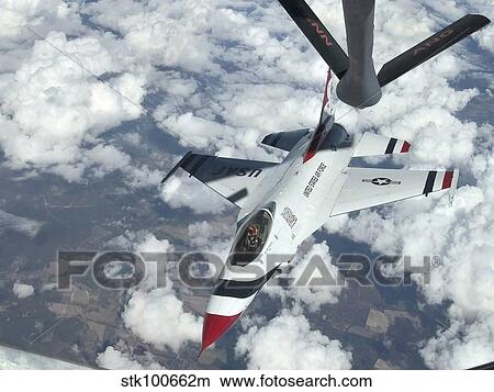 A KC-135 Stratotanker refuels an Air Force Thunderbird. View Large Photo Image Picture - A KC-135 Stratotanker refuels an Air Force Thunderbird.. Fotosearch