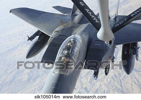 A KC-135 Stratotanker refuels an F-15E Strike Eagle. View Large Photo Image Picture - A KC-135 Stratotanker refuels an F-15E Strike Eagle.. Fotosearch