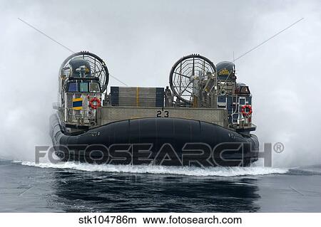 A landing craft air cushion approaches the well deck of USS New Orleans. View Large Photo Image Picture - A landing craft air cushion approaches the well deck of USS New Orleans.. Fotosearch
