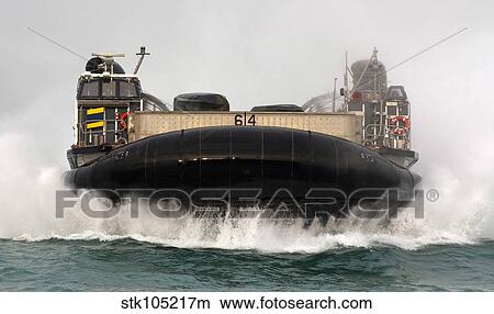 A landing craft air cushion approaches the well deck of USS New Orleans. View Large Photo Image Picture - A landing craft air cushion approaches the well deck of USS New Orleans.. Fotosearch