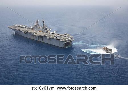 A landing craft air cushion approaches the well deck of USS Kearsarge. View Large Photo Image Picture - A landing craft air cushion approaches the well deck of USS Kearsarge.. Fotosearch