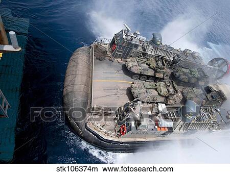 A landing craft air cushion enters teh well deck of USS Iwo Jima. View Large Photo Image Picture - A landing craft air cushion enters teh well deck of USS Iwo Jima.. Fotosearch