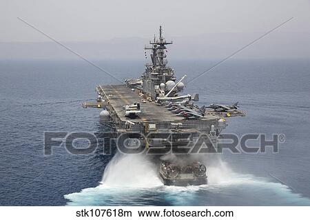 A landing craft air cushion enters the well deck of USS Kearsarge. View Large Photo Image Picture - A landing craft air cushion enters the well deck of USS Kearsarge.. Fotosearch