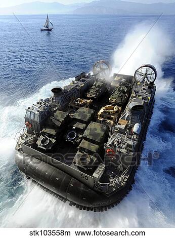 A Landing Craft Air Cushion exits the well deck of USS Bataan. View Large Photo Image Picture - A Landing Craft Air Cushion exits the well deck of USS Bataan.. Fotosearch