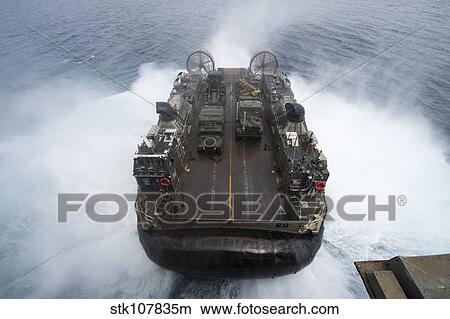 A landing craft air cushion leaves the well deck of USS Kearsarge. View Large Photo Image Picture - A landing craft air cushion leaves the well deck of USS Kearsarge.. Fotosearch