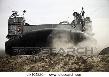 Picture - A landing craft, air cushion prepares to depart Onslow Beach.. Fotosearch