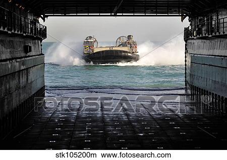 A landing craft air cushion prepares to enter the well deck of USS Pearl Harbor. View Large Photo Image Picture - A landing craft air cushion prepares to enter the well deck of USS Pearl Harbor.. Fotosearch