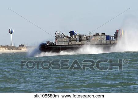 A landing craft air cushion prepares to land on the beach. View Large Photo Image Picture - A landing craft air cushion prepares to land on the beach.. Fotosearch