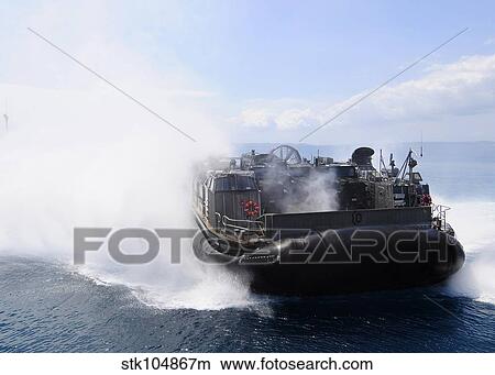 A landing craft air cushion travels at high speed off the coast of Okinawa, Japan. View Large Photo Image Picture - A landing craft air cushion travels at high speed off the coast of Okinawa, Japan.. Fotosearch