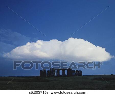Stock Photograph - A large cloud over Stonehenge, Wiltshire, England.. Fotosearch