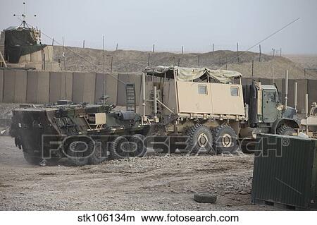 A light armored vehicle being towed at a military base in Afghanistan. View Large Photo Image Picture - A light armored vehicle being towed at a military base in Afghanistan.. Fotosearch