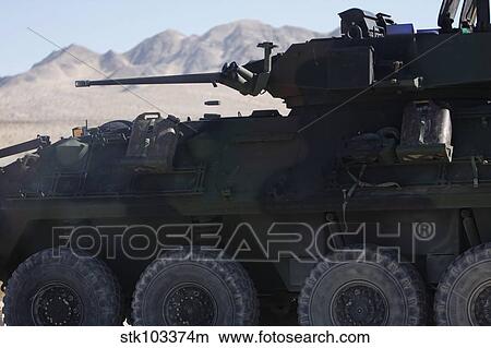 A light armored vehicle fires its 25mm Bushmaster chain gun. View Large Photo Image Picture - A light armored vehicle fires its 25mm Bushmaster chain gun.. Fotosearch