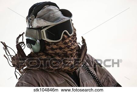 A loadmaster protects his head from the intense heat generated by C-130 Hercules engines. View Large Photo Image Picture - A loadmaster protects his head from the intense heat generated by C-130 Hercules engines.. Fotosearch