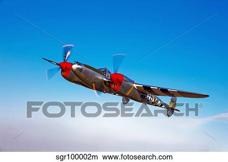 A Lockheed P-38 Lightning fighter aircraft in flight. View Large Photo Image Picture - A Lockheed P-38 Lightning fighter aircraft in flight.. Fotosearch