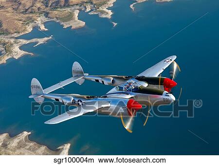 A Lockheed P-38 Lightning fighter aircraft in flight. View Large Photo Image Picture - A Lockheed P-38 Lightning fighter aircraft in flight.. Fotosearch