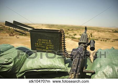 A M240B medium machine gun is positioned at an observation post. View Large Photo Image Picture - A M240B medium machine gun is positioned at an observation post.. Fotosearch