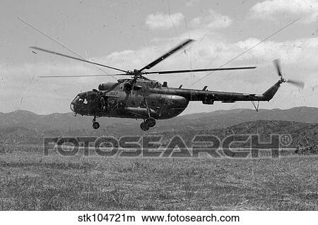 Picture - A Macedonian MI-17 helicopter landing as part of a medical transport flight.. Fotosearch