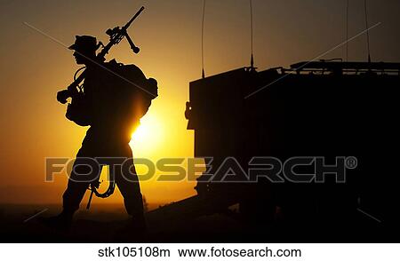 A machine gunner prepares to load an amphibious assault vehicle. View Large Photo Image Picture - A machine gunner prepares to load an amphibious assault vehicle.. Fotosearch