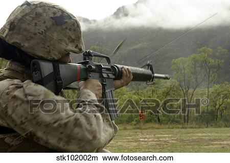 A Marine conducts drills with an M16-A2 service rifle. View Large Photo Image Picture - A Marine conducts drills with an M16-A2 service rifle.. Fotosearch