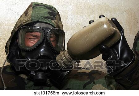 A marine drinks water from a canteen. View Large Photo Image Picture - A marine drinks water from a canteen.. Fotosearch