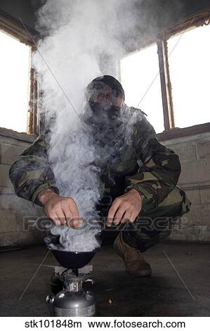 A marine fills the gas chamber with more CS gas. View Large Photo Image Picture - A marine fills the gas chamber with more CS gas.. Fotosearch